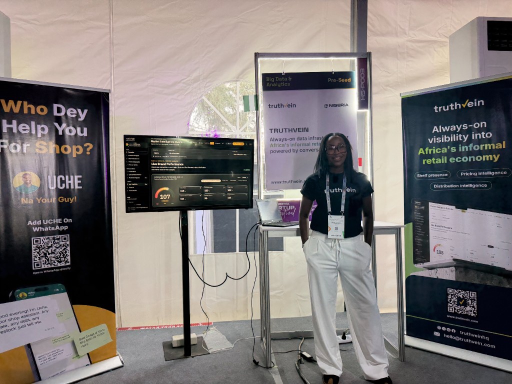 The TruthVein stand, with live brand performance on the screen